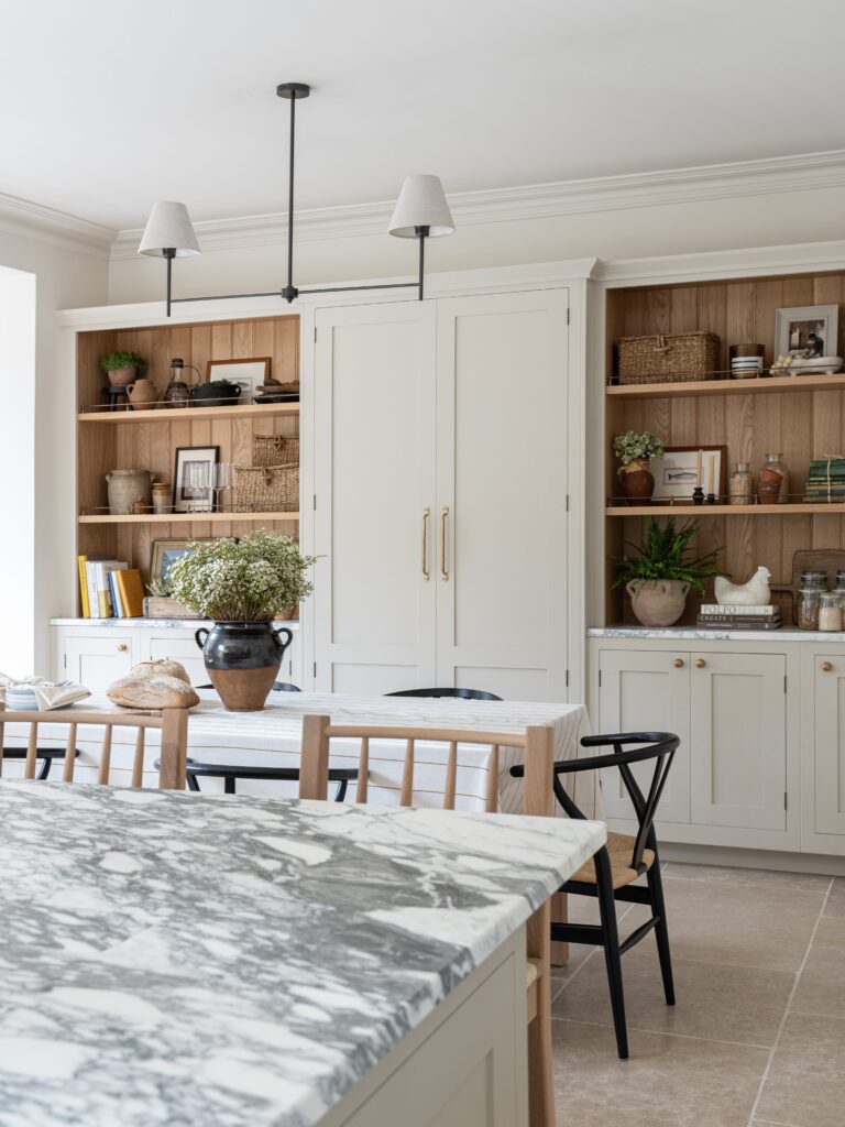 Modern farmhouse kitchen with bespoke cabinetry and decorative dresser shelves