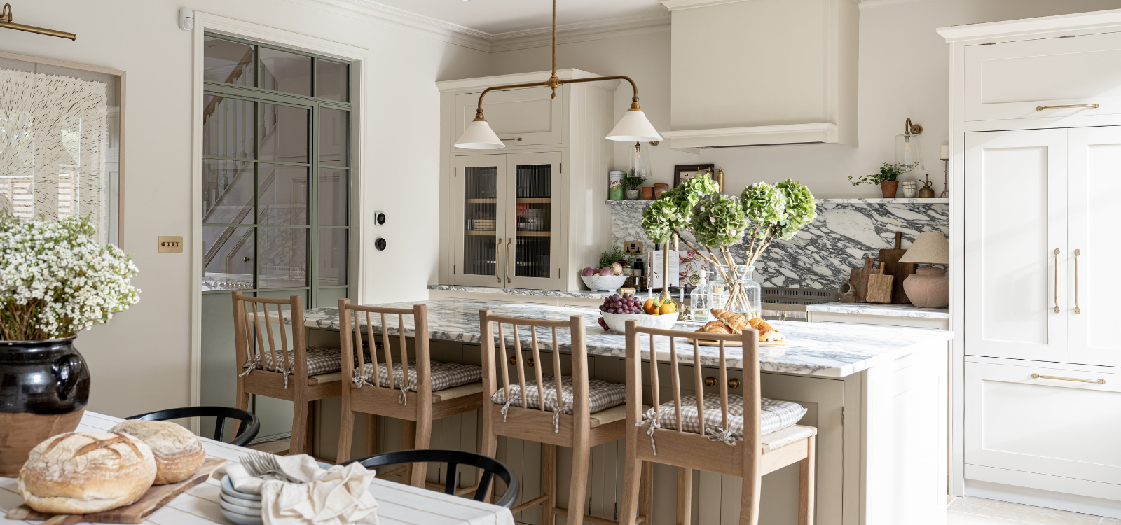 Modern farmhouse kitchen with bespoke island and marble countertops