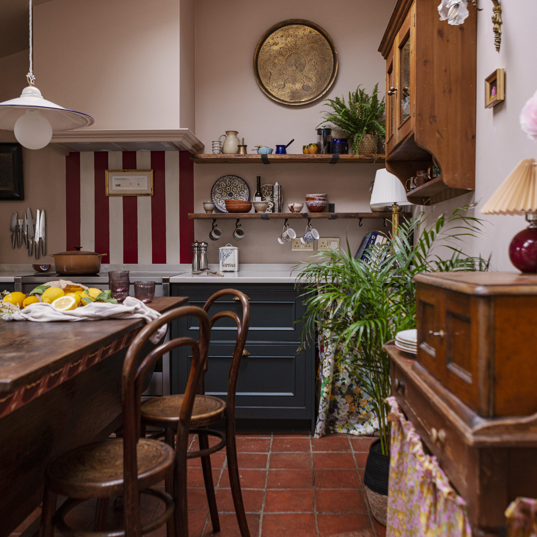 Eclectic kitchen design with dedicated breakfast station zone featuring rustic wooden shelving and hanging mug space