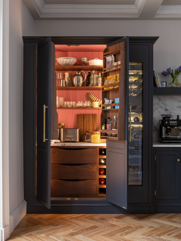 Luxury kitchen with integrated breakfast dresser that works as a bar space with an integrated wine fridge