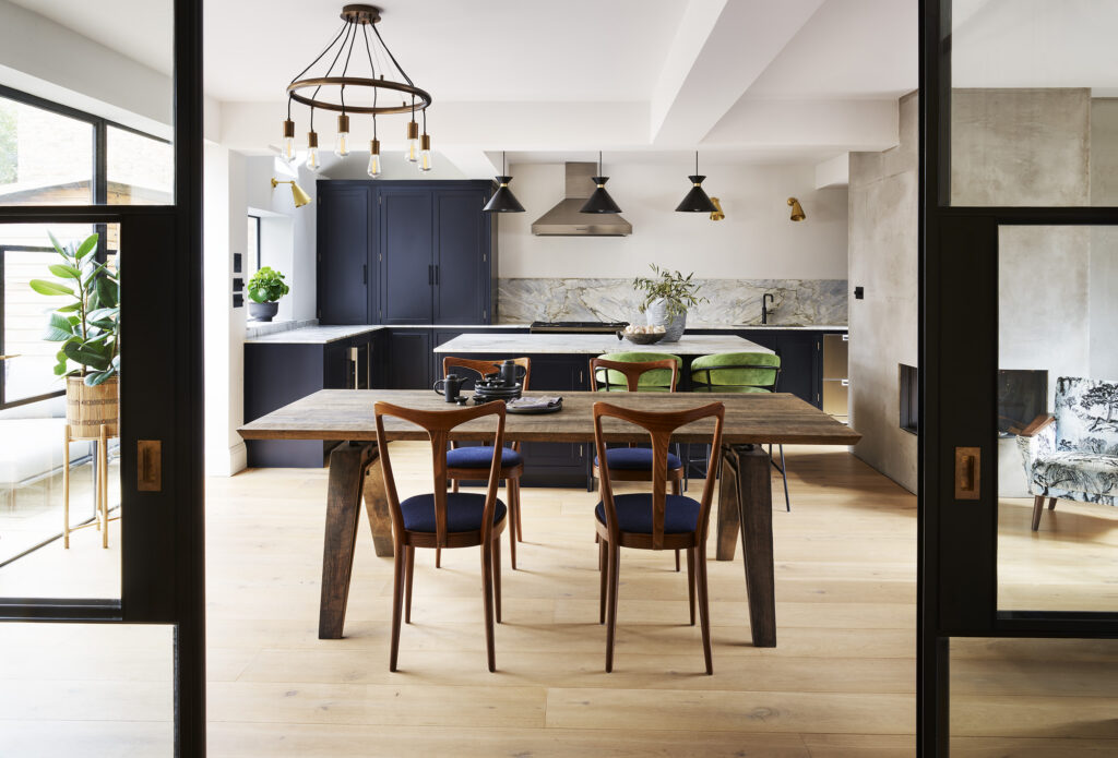 Navy blue kitchen diner with wood accents and crittall sliding doors