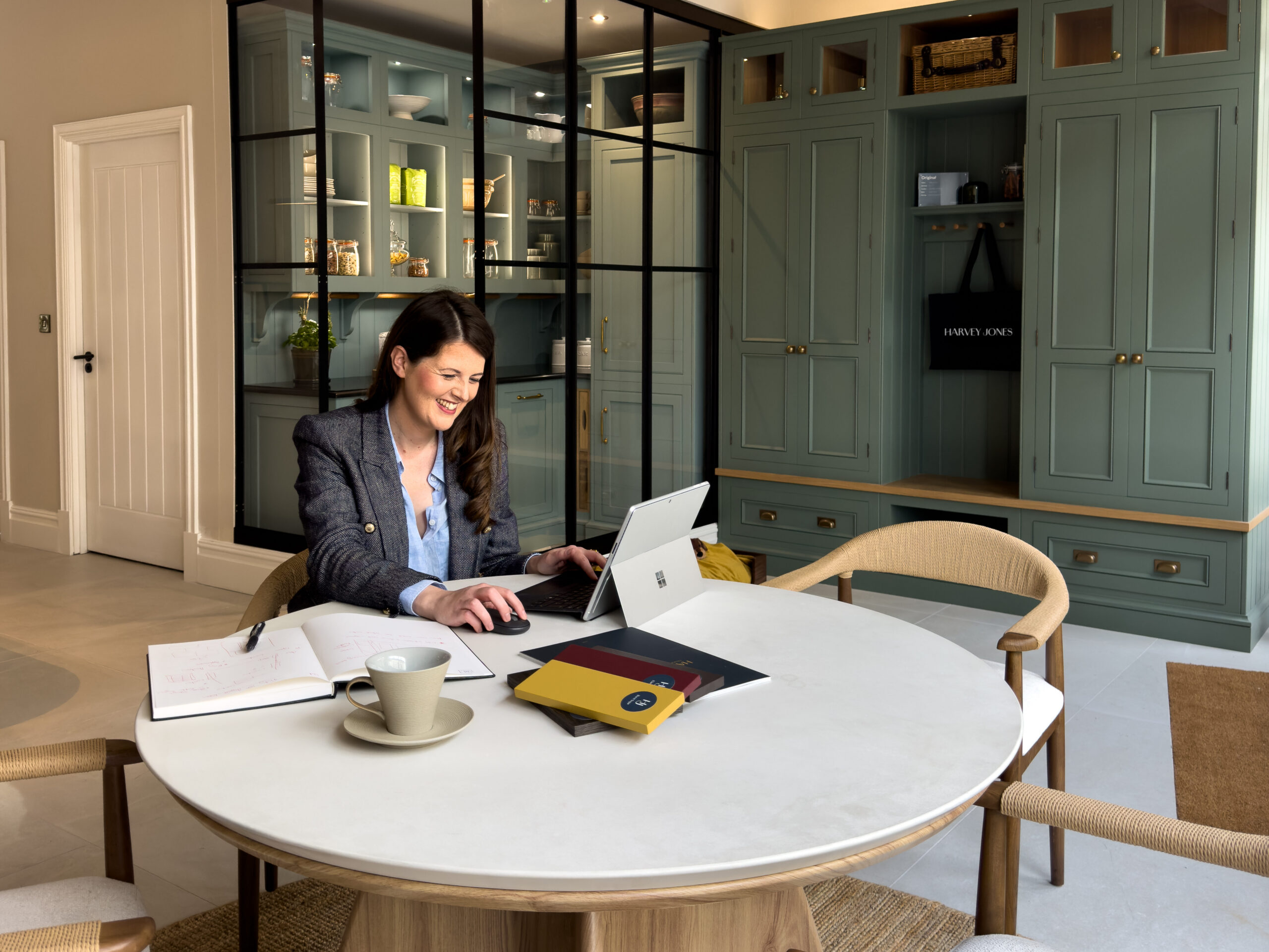 Harvey Jones kitchen designer, Claire Watson, in bespoke kitchen showroom