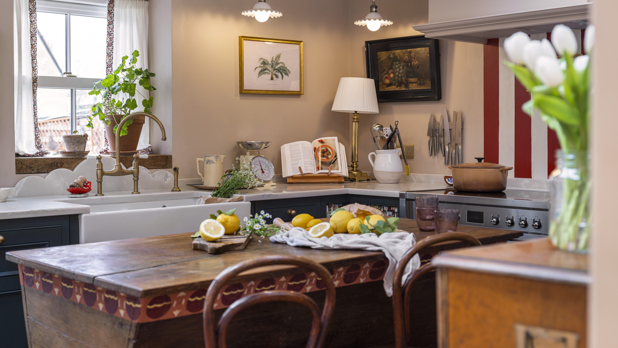 Eclectic vintage style kitchen with bespoke cabinetry and freestanding island unit as an alternative to a traditional kitchen island