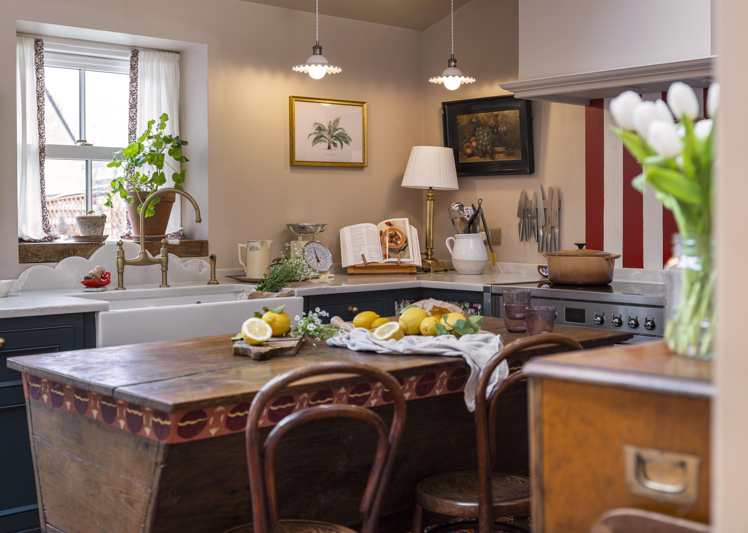 Eclectic vintage style kitchen with bespoke cabinetry and freestanding island unit
