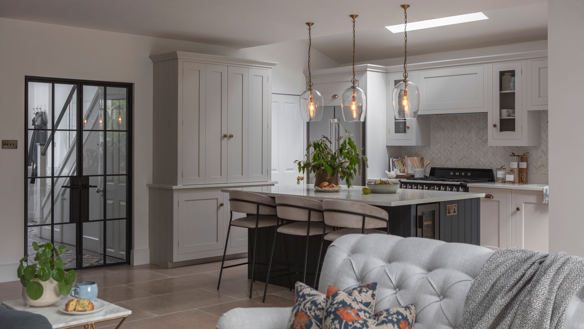 Bespoke Shaker kitchen in open plan layout with neutral and navy colour palette