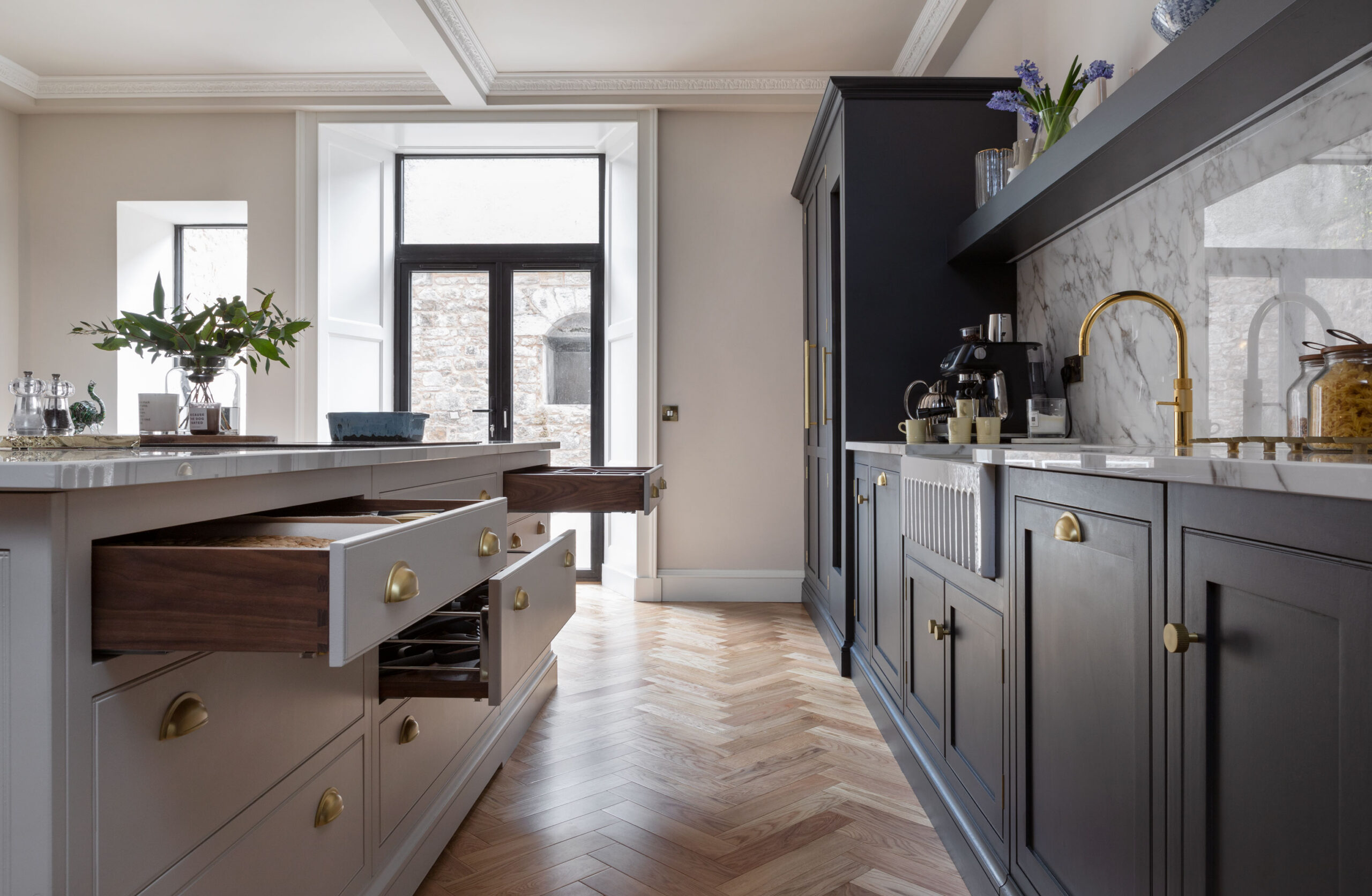 Two tone kitchen design with wooden flooring, oak internal drawers and in frame construction