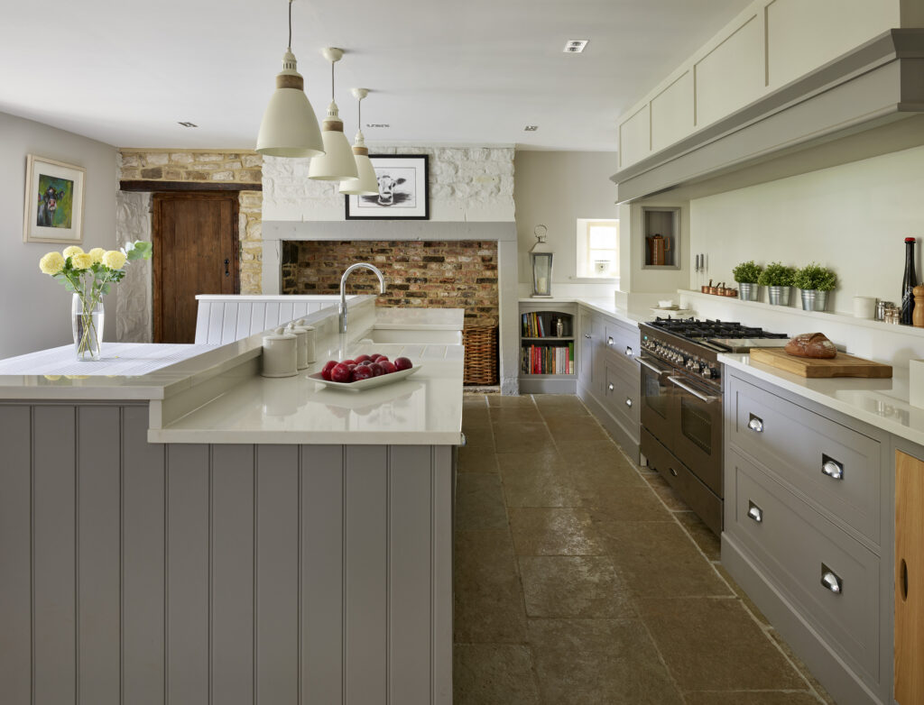 Greige bespoke kitchen with shaker style cabinetry and island with tongue and groove panelling
