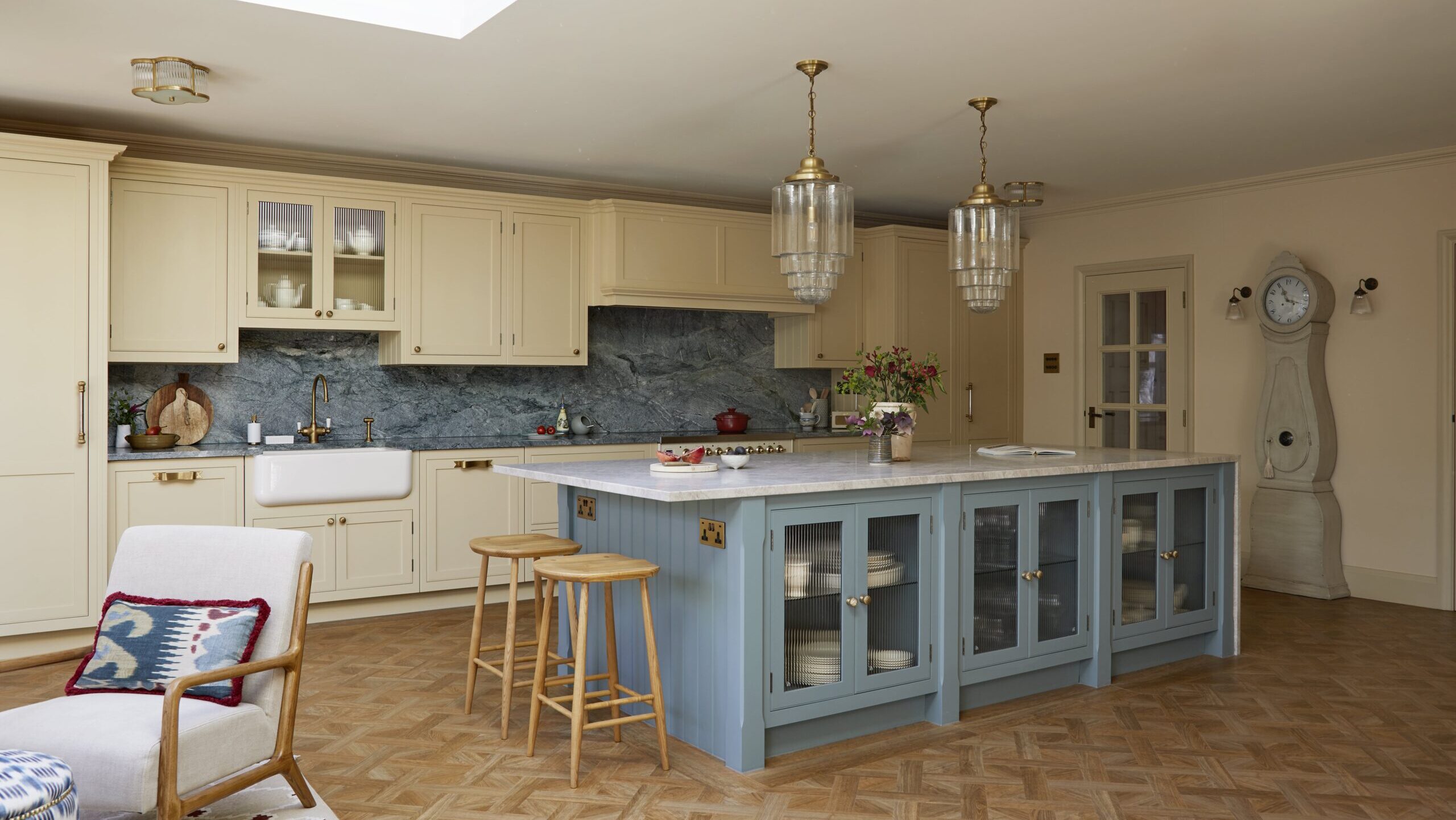 yellow and light blue kitchen with blue marble backsplash