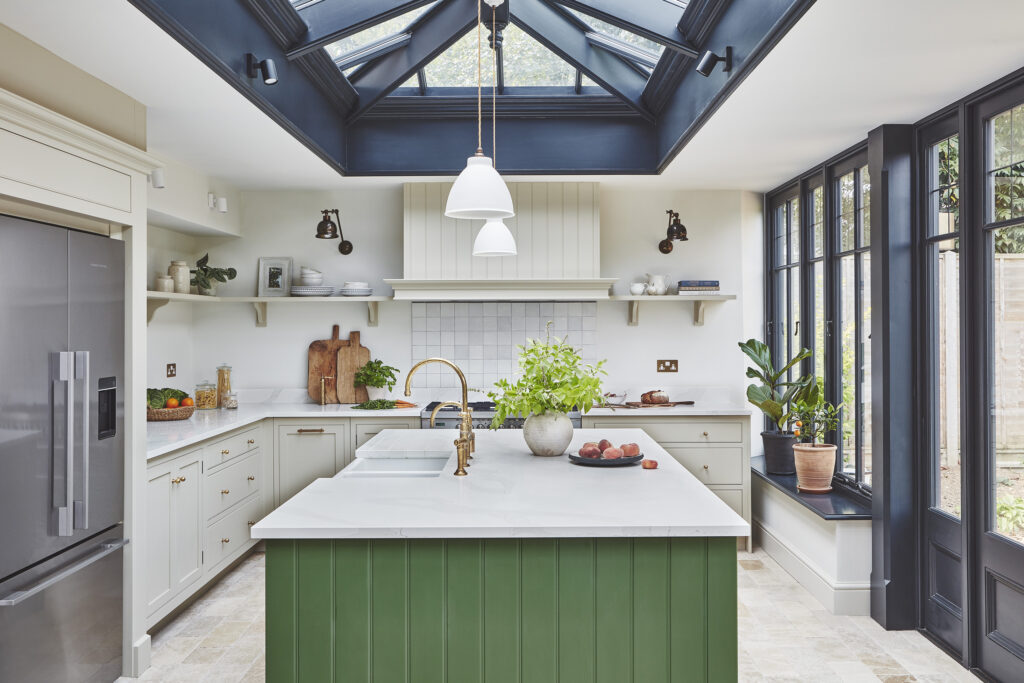Green and neutral L shaped kitchen design