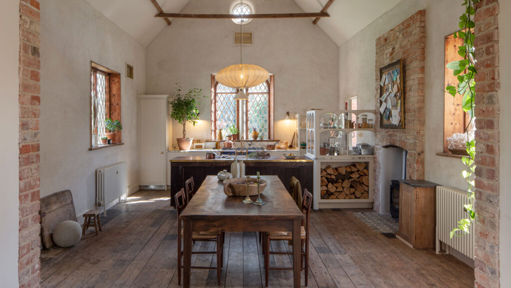 Longshot of an Arbor kitchen in a rectory renovation featuring a dining area
