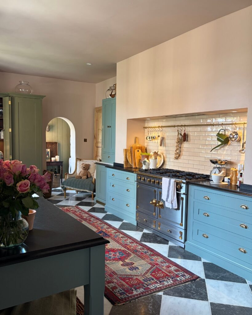 Blue Harvey Jones Victorian galley kitchen design with checkerboard flooring and range cooker